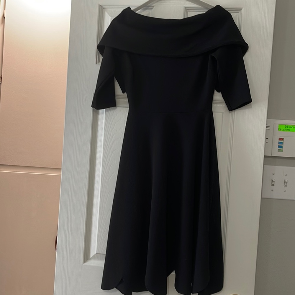 Black Off shoulder with a unique style at the bottom for any occasion.